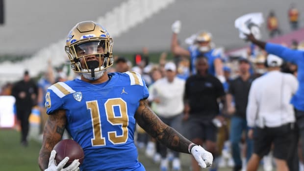 Nov 20, 2021; Los Angeles, California, USA; UCLA Bruins running back Kazmeir Allen (19) returns a kick for a touchdown against the Southern California Trojans in the second half at the Los Angeles Memorial Coliseum. Mandatory Credit: Richard Mackson-USA TODAY Sports